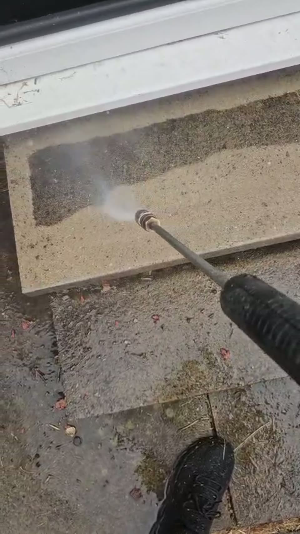 Close-up of dirt being lifted from paving